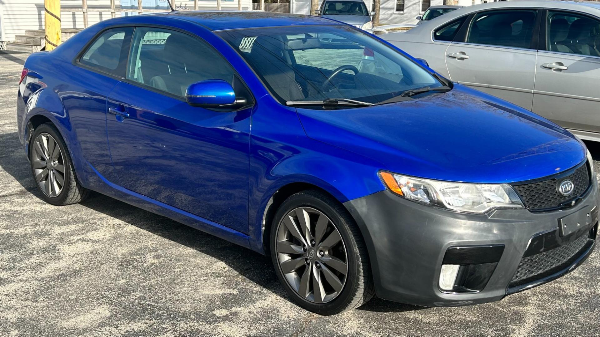 2011 Blue /BLACK Kia Forte Koup SX (KNAFW6A35B5) with an 2.4L L4 DOHC 16V engine, located at 2710A Westlane Rd., Indianapolis, IN, 46268, (317) 291-2000, 39.885670, -86.208160 - Photo#4